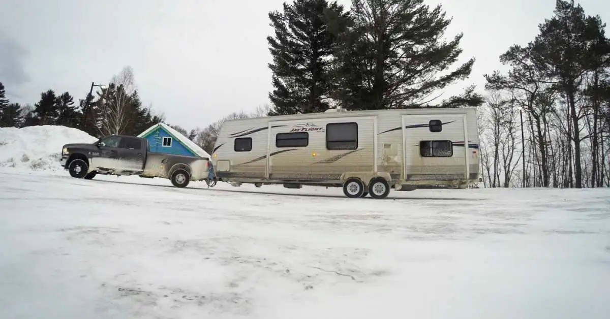 Travel trailer in the winter snow tow