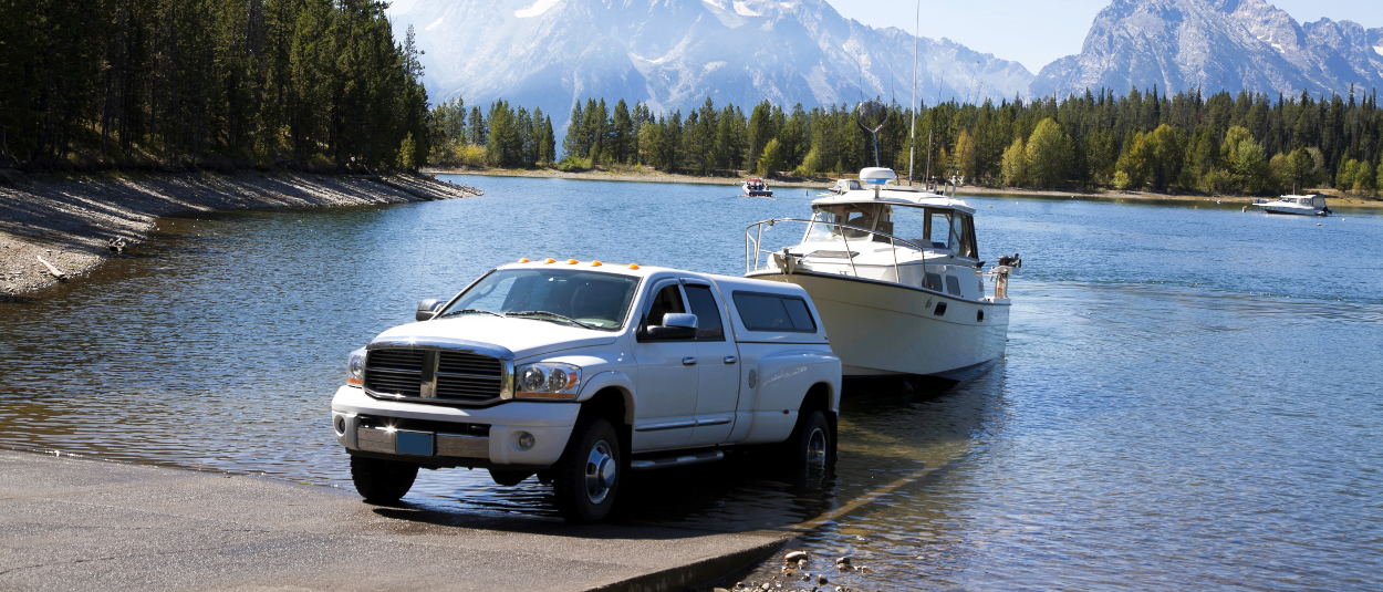 CURT trailer hitches - Dodge Ram truck launching boat into lake