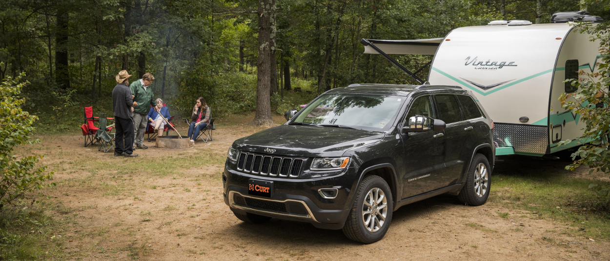 CURT trailer hitches - family camper at the campsite - Jeep Cherokee