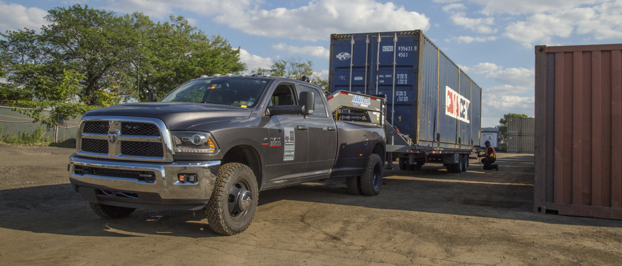 CURT gooseneck hitch on truck towing flatbed trailer