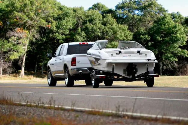 Pickup Truck Towing Boat Trailer