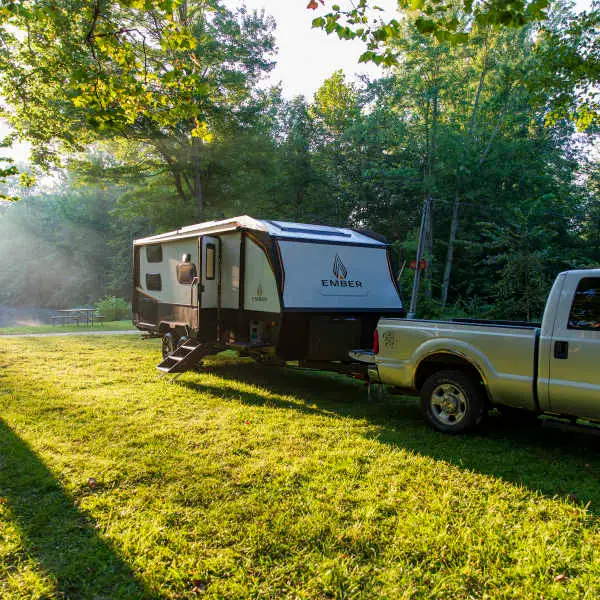 RV travel trailer parked at campsite