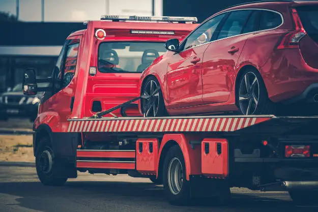 Tow Truck Hauling Car