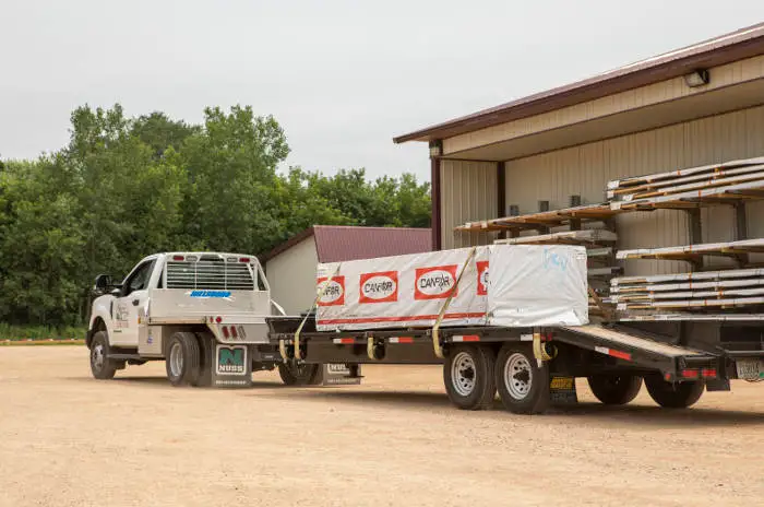 Work Truck Towing Large Flatbed Trailer